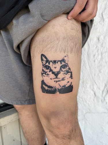 Feather and Bone Tattoo in Austin